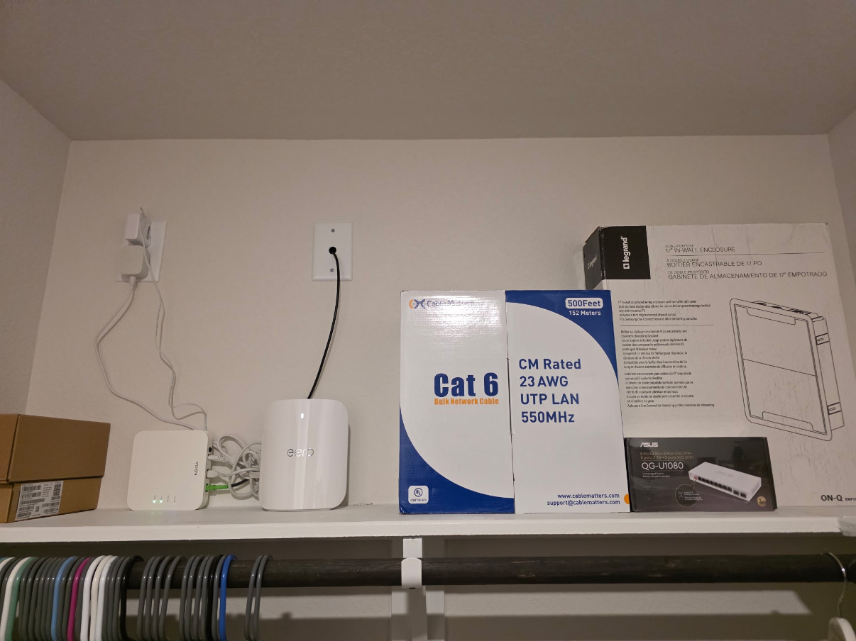 Before: network equipment and cable boxes on a closet shelf